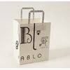 white kraft paper carry bag with flat handle